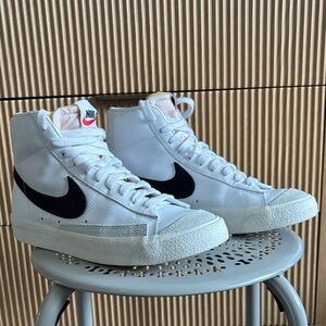 Nike White High-Top Sneakers with Black Swoosh
